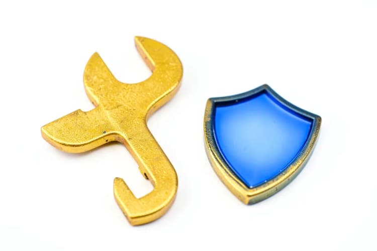 Um ícone de ferramenta com um escudo, representando segurança e serviços.